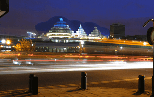 A view of The Glasshouse from Newcastle Quayside at night.