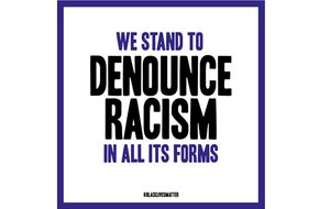 We stand to denounce racism in all its forms.