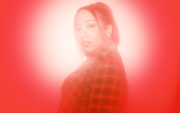 Nadedja in a red haze and checked jacket