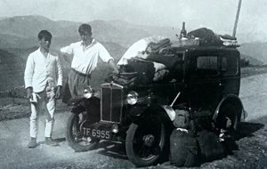 Michael Tippett and Wilf Franks next to a car