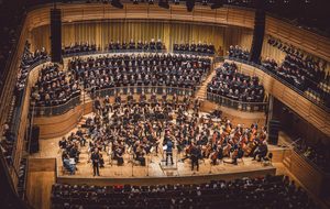 The stage full of musicians wearing black for Share the Stage