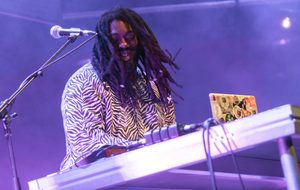 Dirty Freud playing the keyboard with their hair swinging.