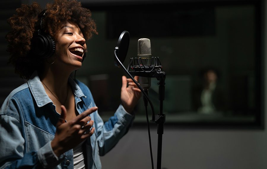 An young professional smiling energetic african female singer we