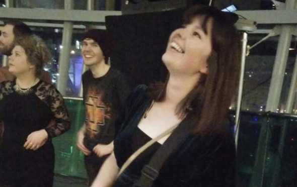 Jo playing the guitar