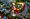 2 Selective focus on naughty Christmas elf sat in a decorated Christmas tree