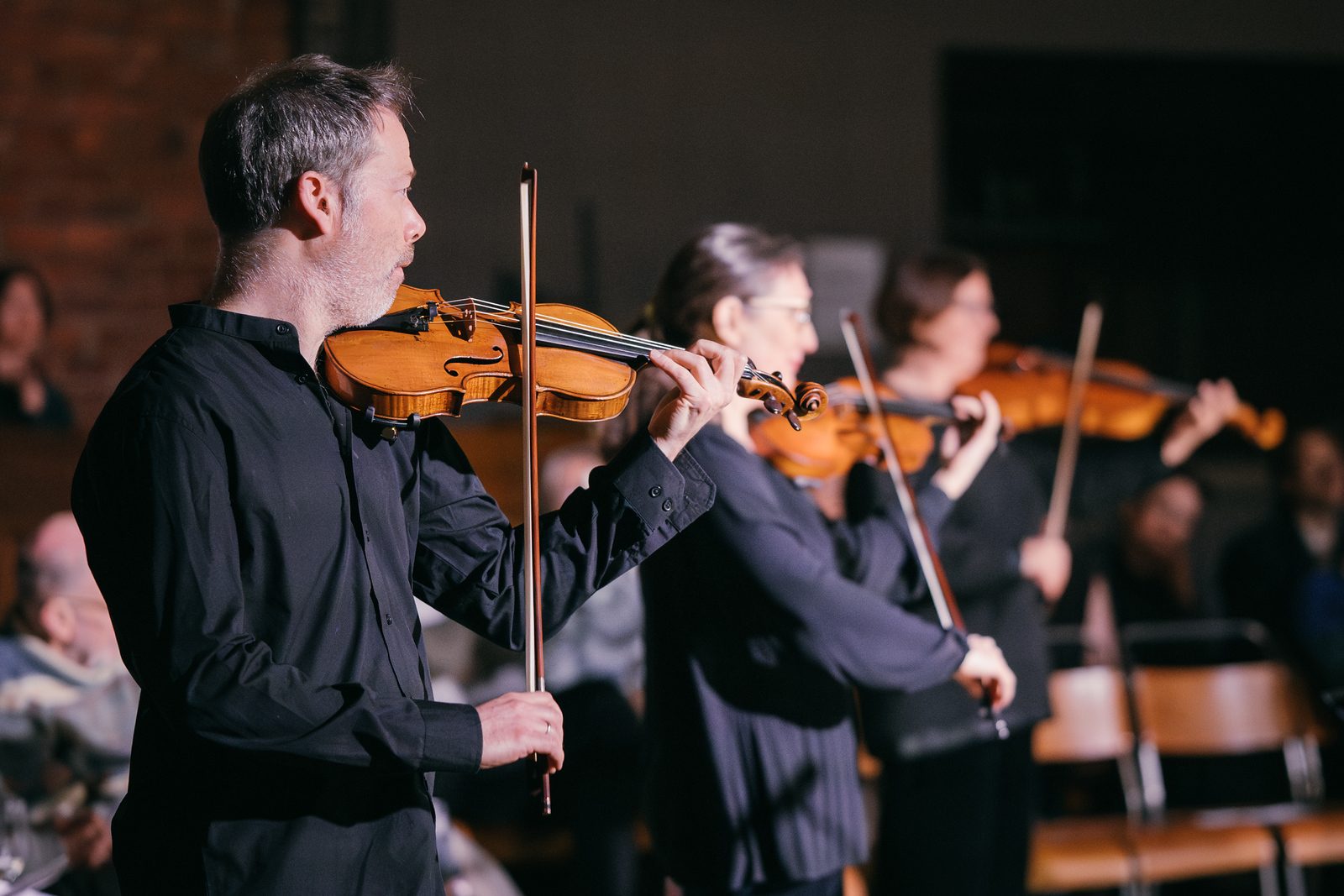 RNS Moves musicians playing violins together.
