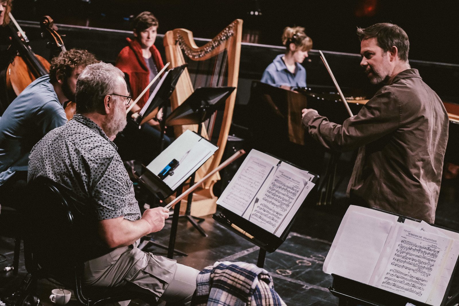 RNS Moves musicians rehearsing together on stage.