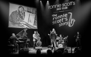 The Ronnie Scott's All Stars Band play Jazz on a stage.